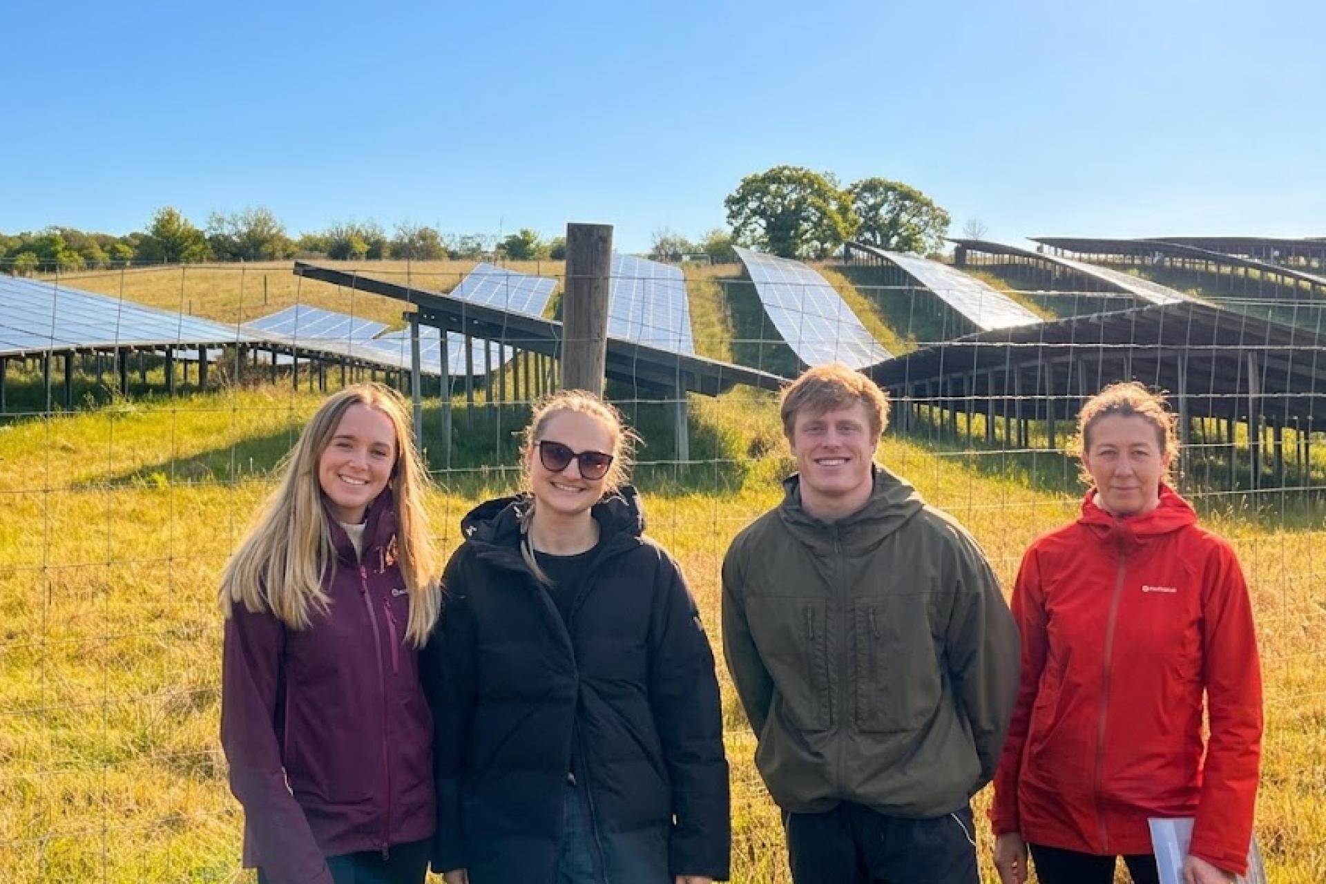 The Younity team visiting a community solar array
