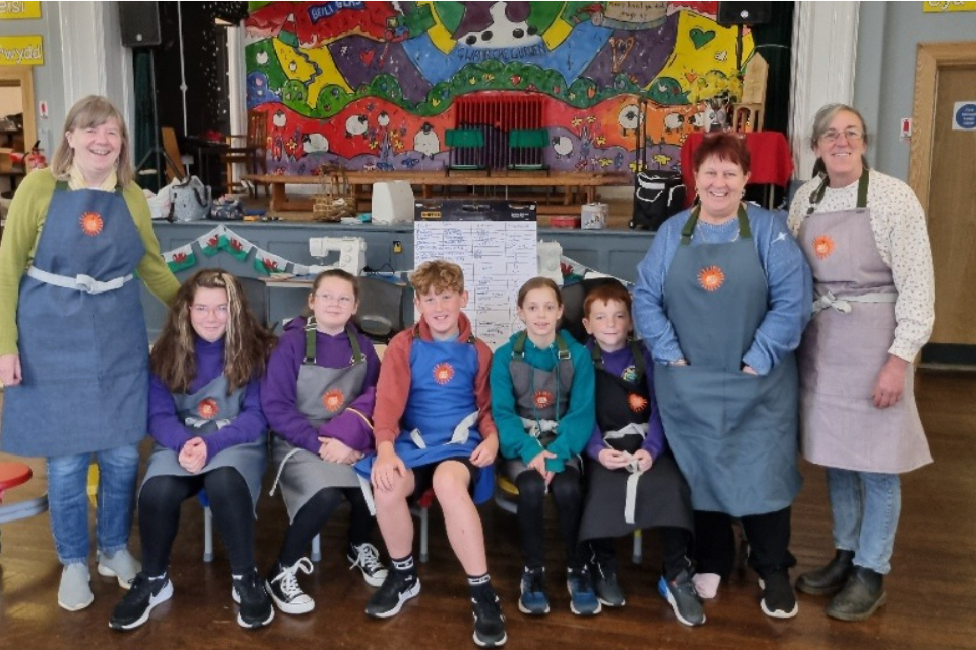 Community Energy Group Aman Awel Tawe stood with children during a workshop funded by our Powering Communities Fund