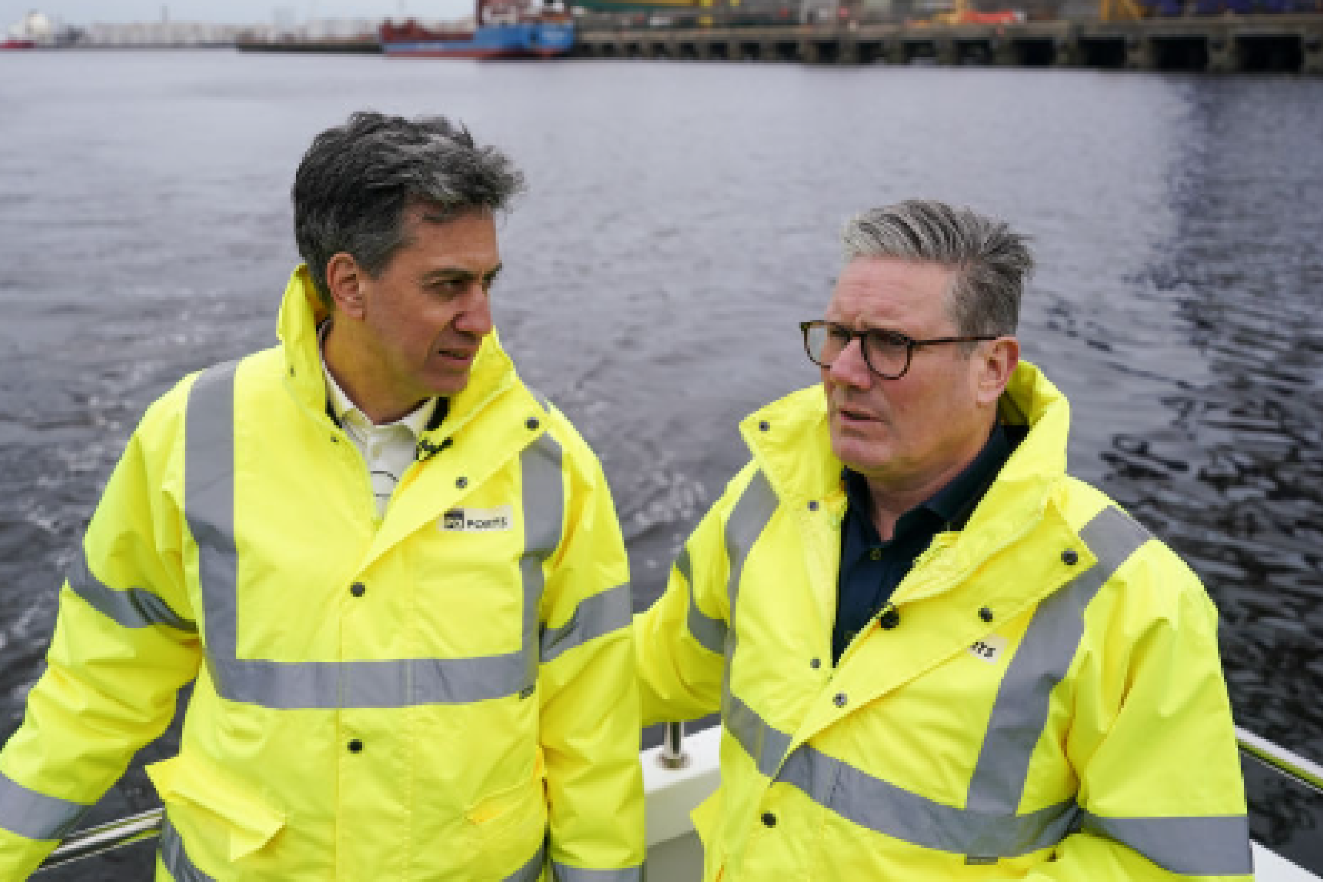 Prime Minister Keir Starmer and Energy Security Secretary Ed Miliband speaking on a boat.