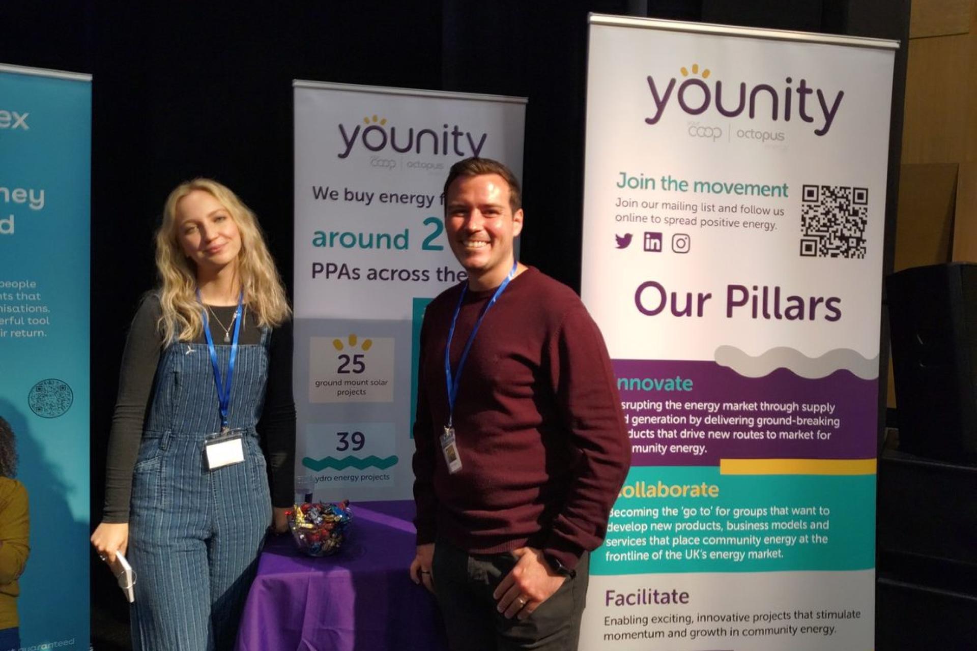 Younity colleagues presenting at an event