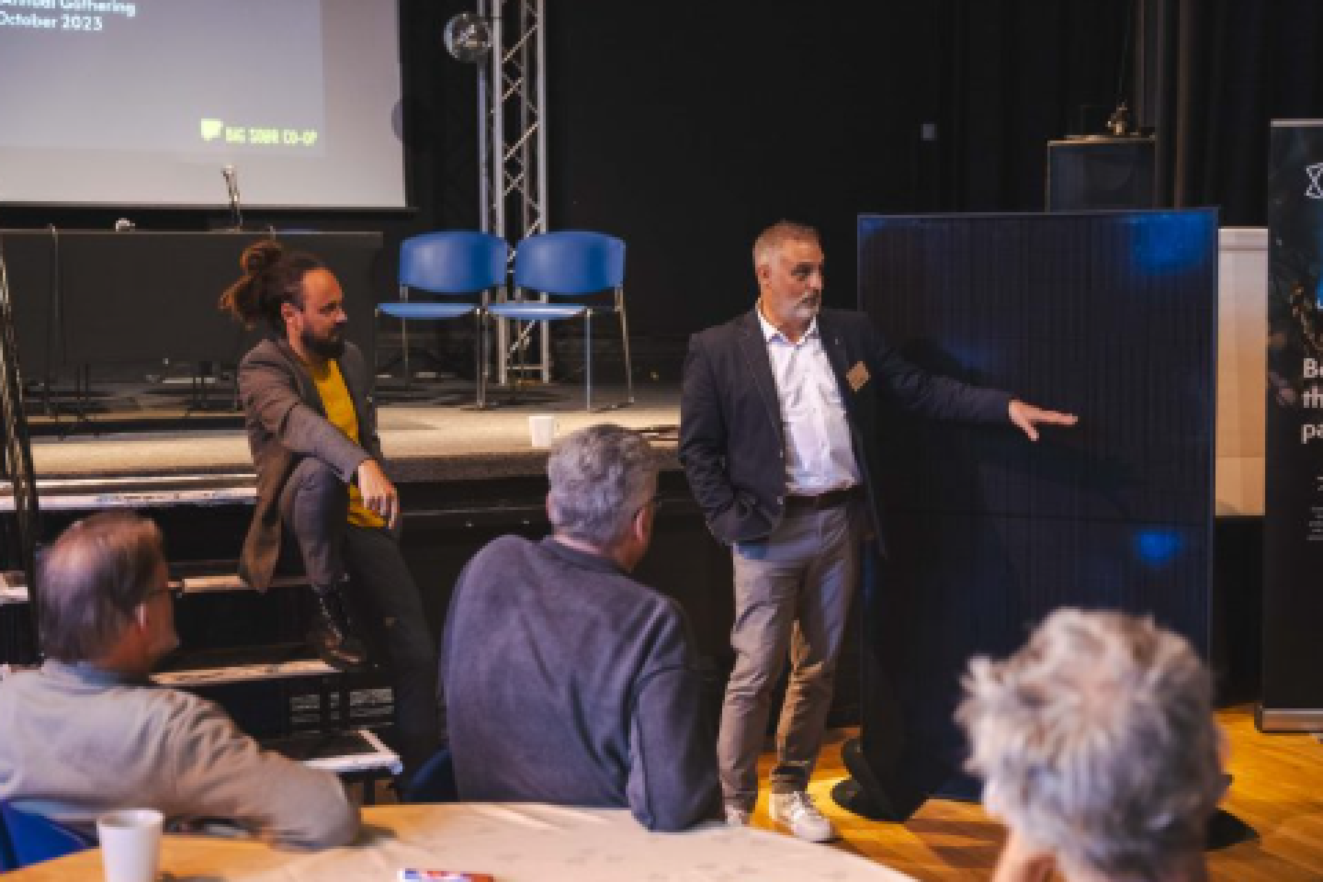 Crowd and activities at the Big Solar Co-op’s Big Solar Gathering in 2024, celebrating community solar projects.