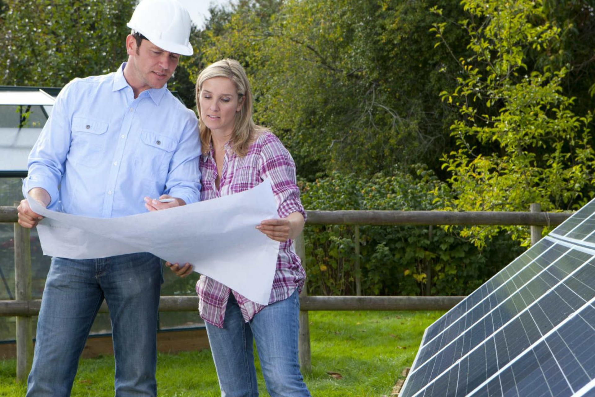 Engineers working together on a solar energy project.