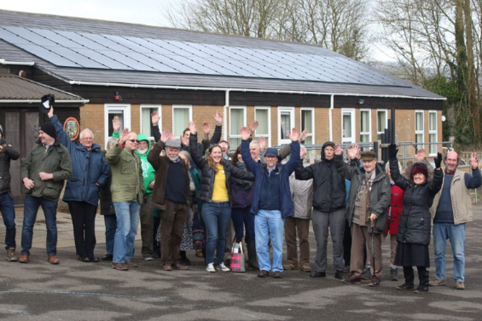 Dorset Community Energy group gathered in front of a solar installation they helped develop.