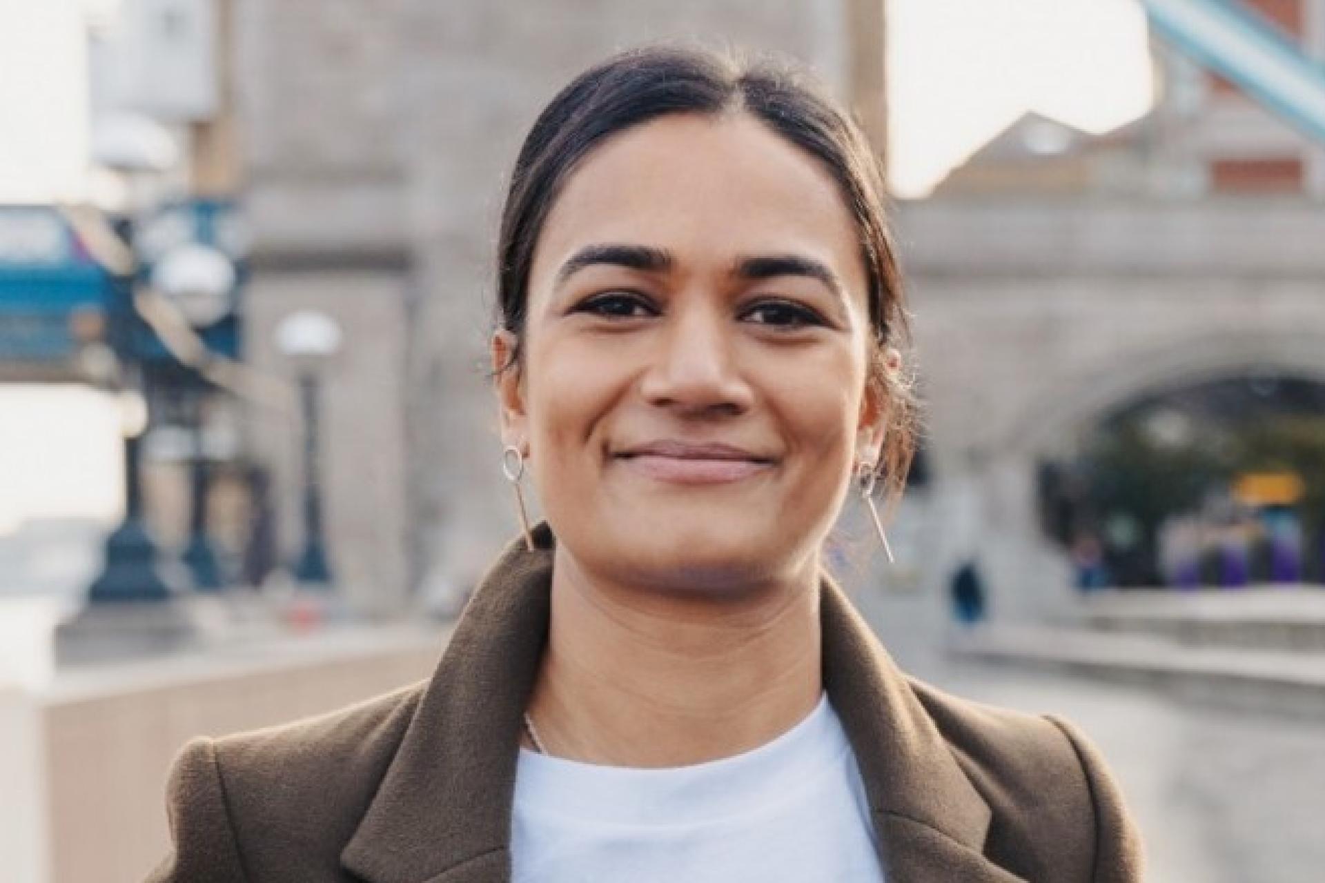 Reysha Younity's newest board members standing confidently for a group headshot with the iconic Tower Bridge in the background, symbolizing leadership and vision.