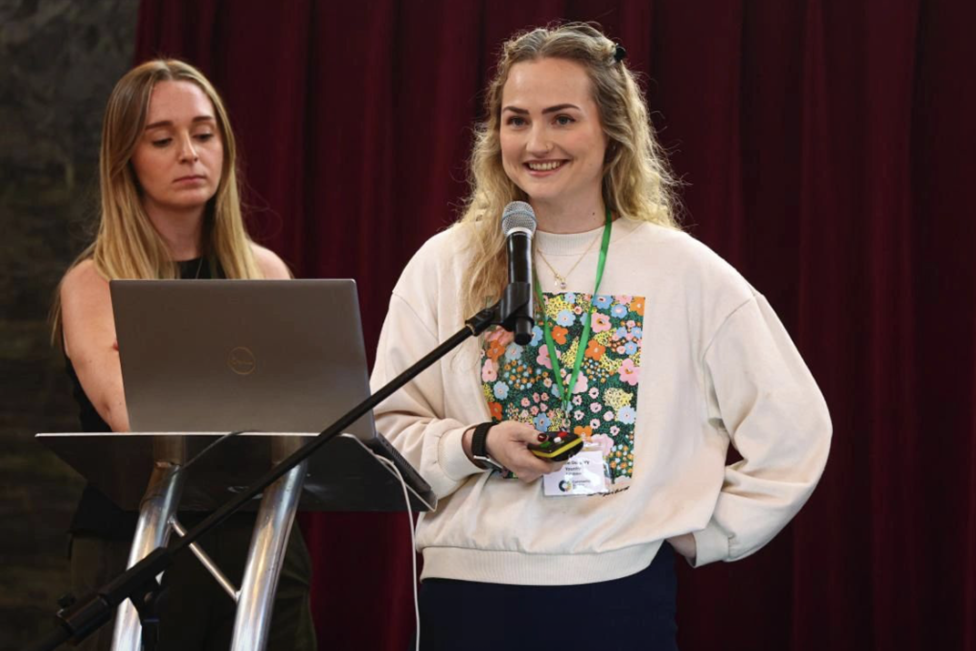 The Younity team delivering a talk on stage during the a community energy conference
