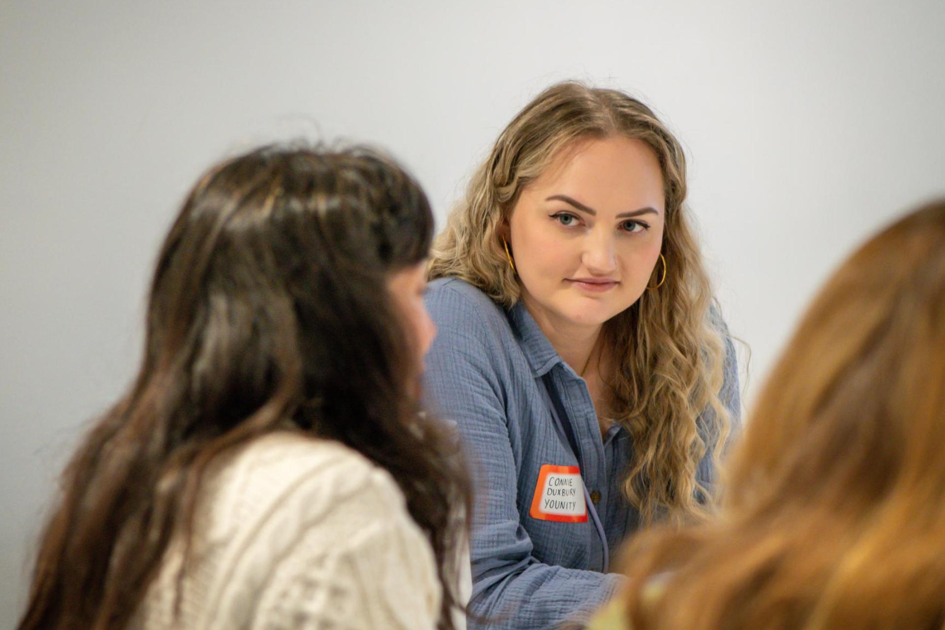 A younity team member participating in a breakout room at an event.