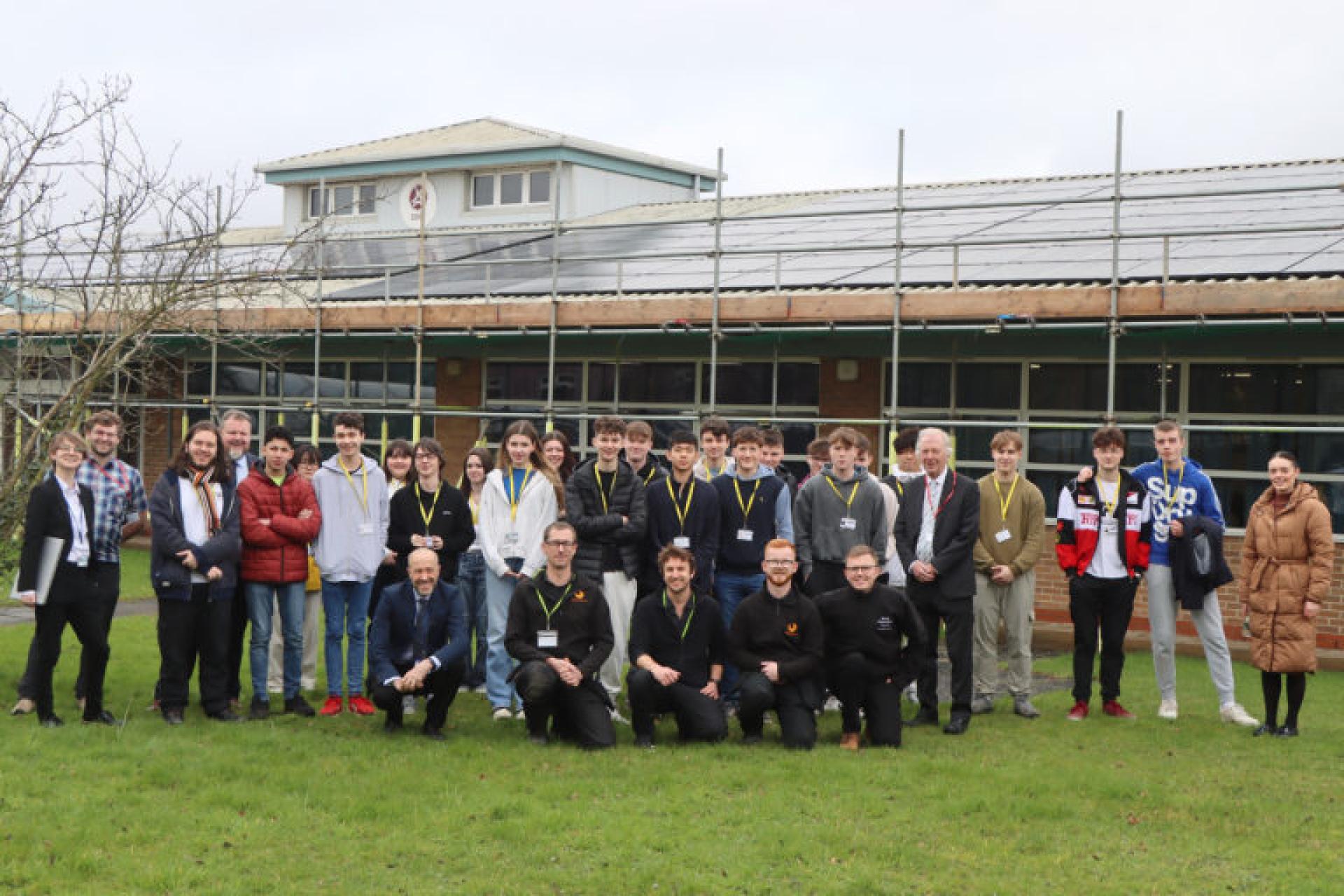 Students at John Leggott College, with solar installation on the rooftop