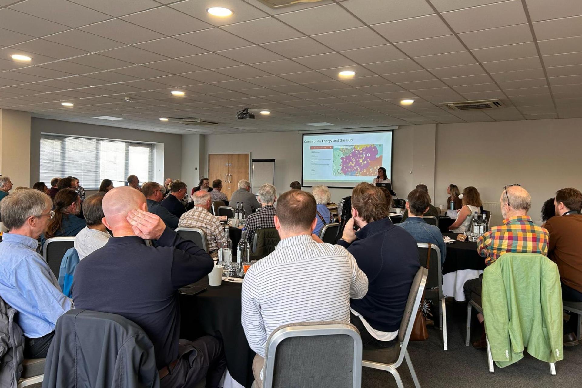 A room full of people participating in a workshop.